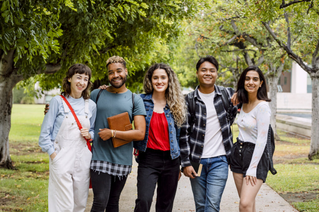 Diverse university students at campus in summertime